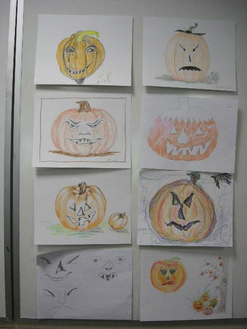 Halloween jack-o-lantern drawings by adult student class.